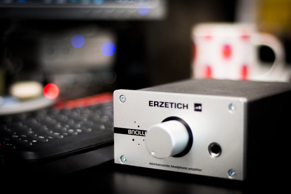 Close-up of a headphone amplifier in a studio setting, showcasing sleek design and advanced technology. — Photo by Blaz Erzetic on Pexels