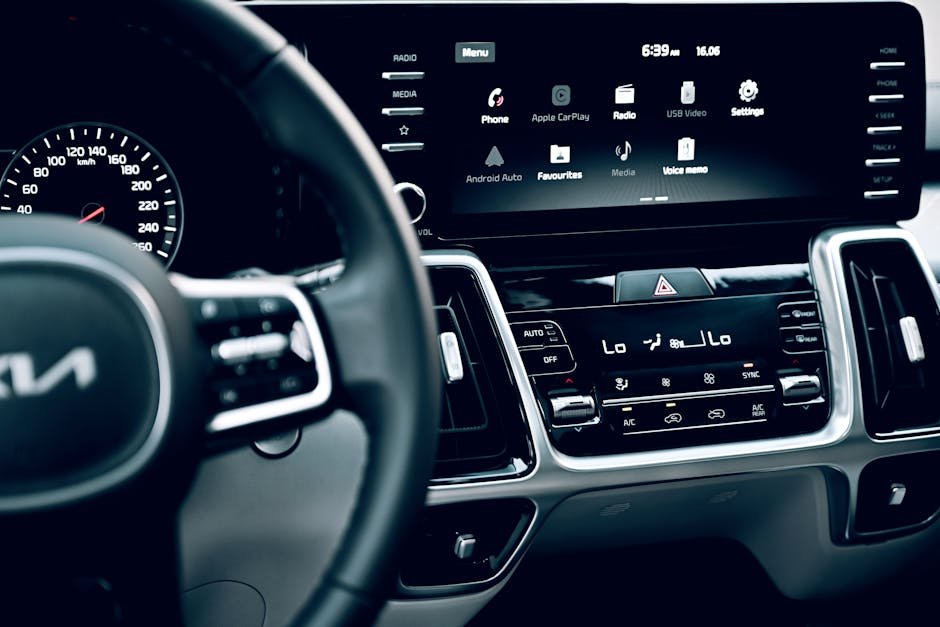 Close-up view of a luxury car's dashboard featuring a modern touchscreen display and advanced features. — Photo by Jeffrey Paa Kwesi Opare on Pexels