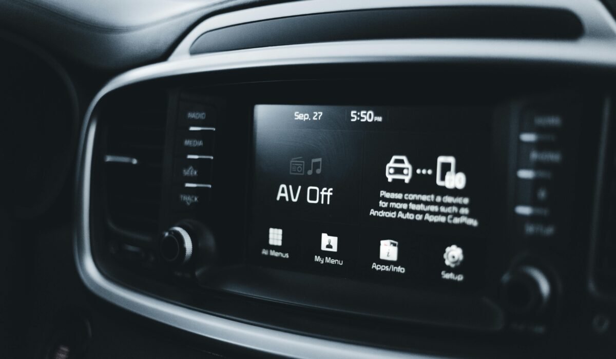 Detailed close-up of a modern car dashboard screen displaying various tech options and settings. — Photo by Erik Mclean on Pexels