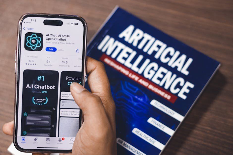 Smartphone displaying AI app with book on AI technology in background. — Photo by Sanket Mishra on Pexels